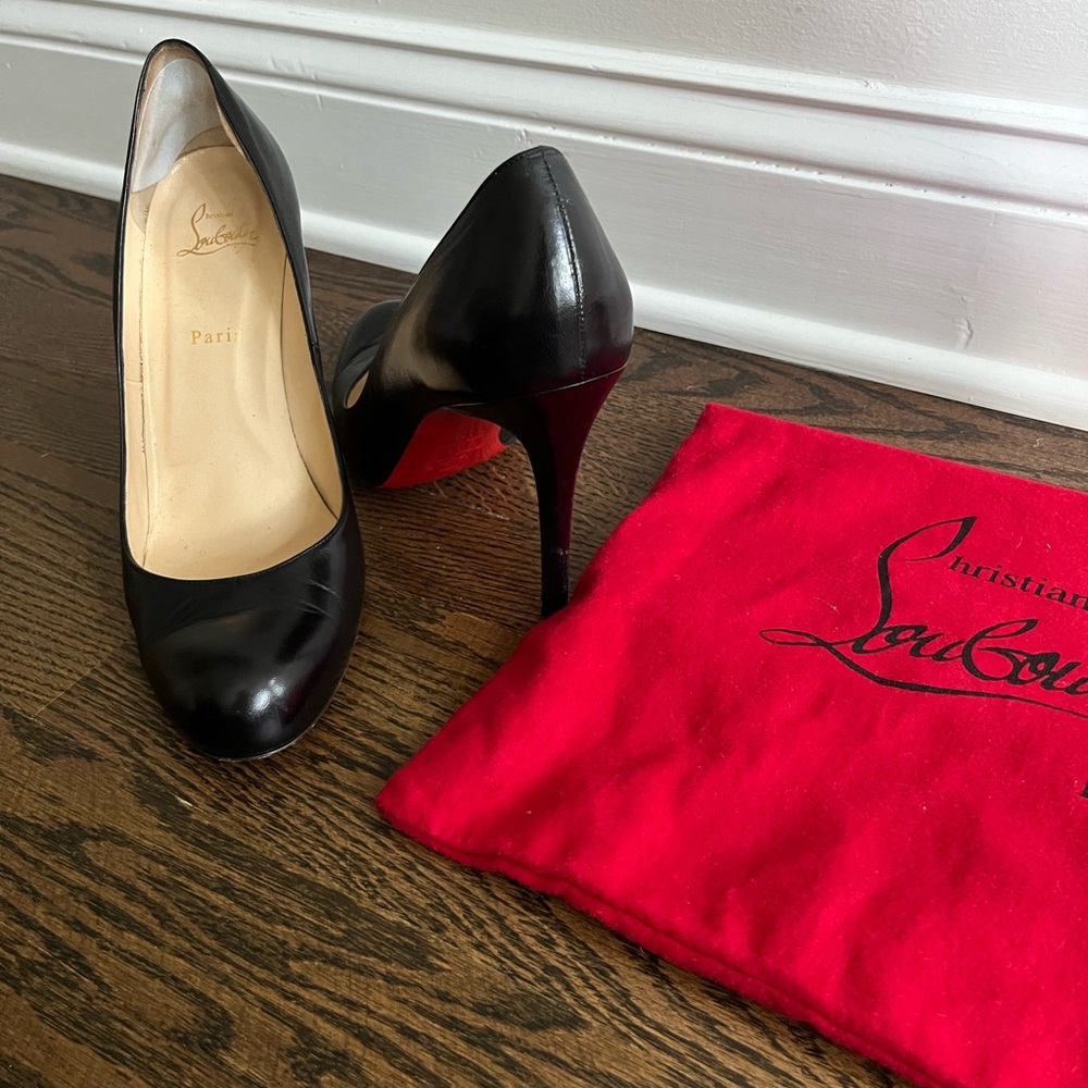 Christian Louboutin black leather pumps